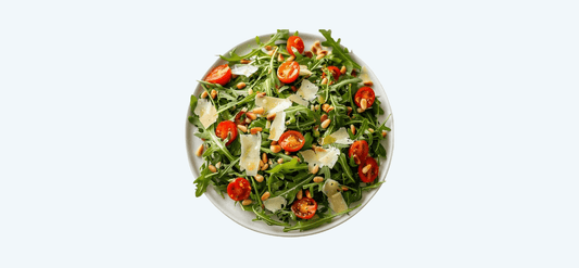 The Original VIVO Salad featuring fresh arugula, cherry tomatoes, and shaved parmesan.